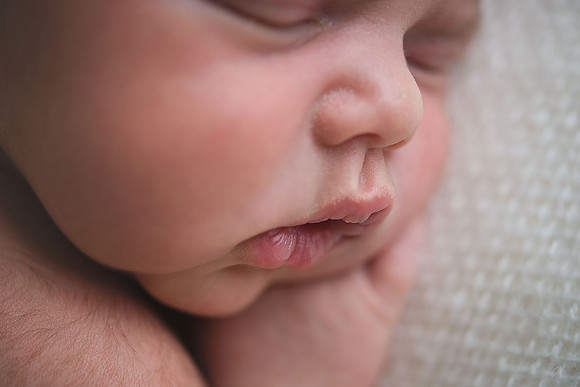 Close up detailed photo of a newborn babies lips and nose
